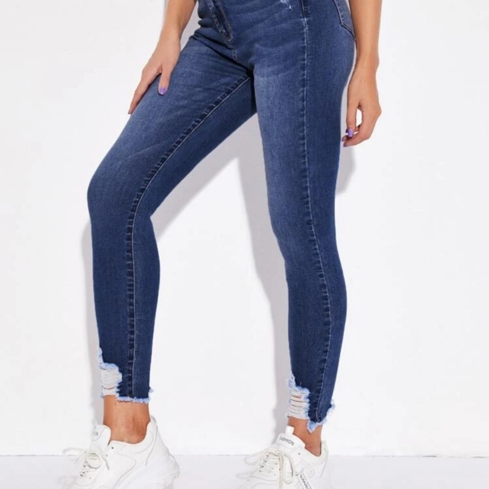 High-rise frayed skinny jeans